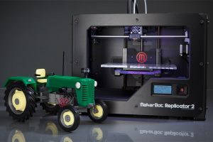 Impressora 3D em funcionamento com objetos sendo criados camada por camada